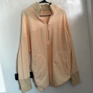 Free people movement thin fleece in pale orange large
